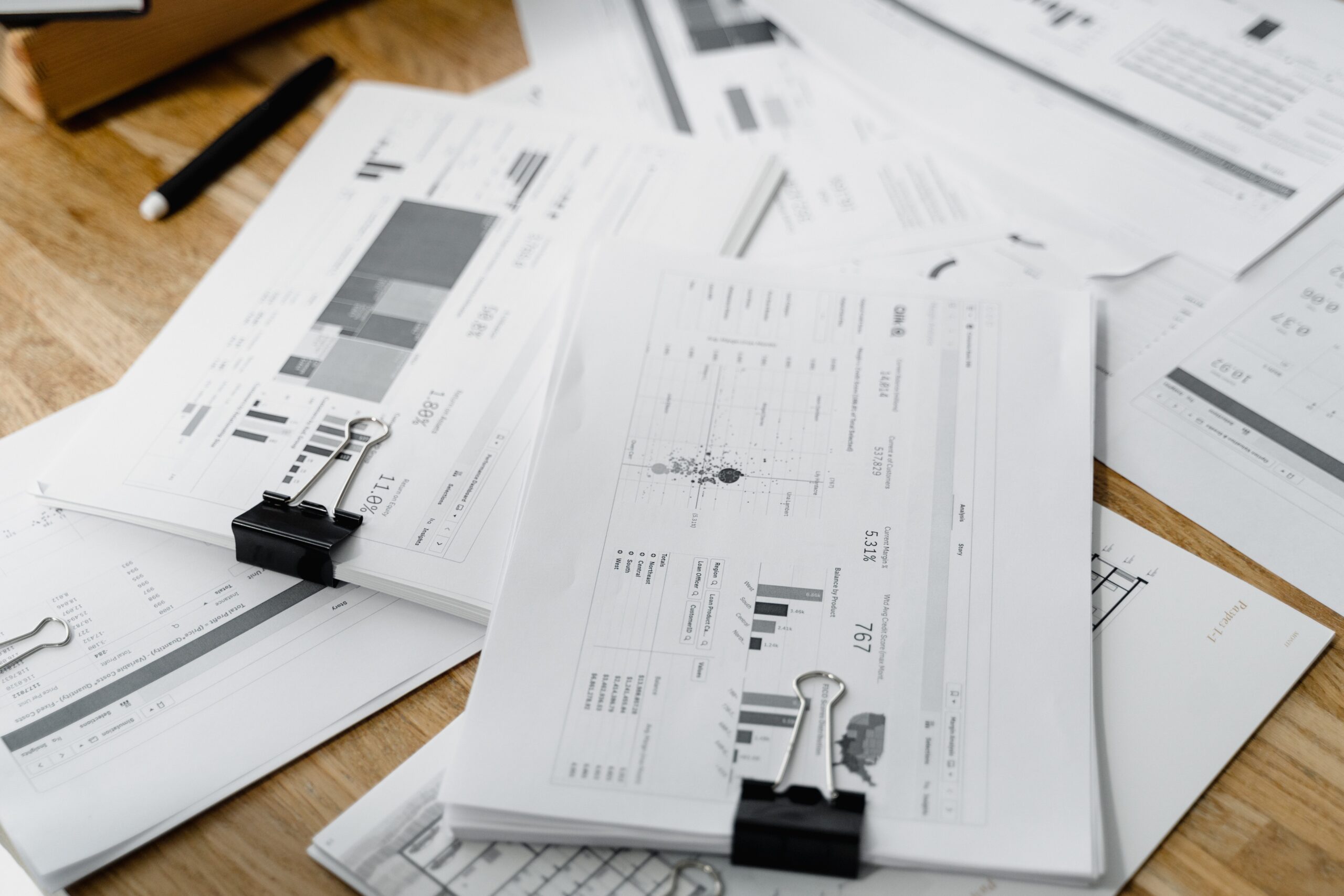 Financial and business documents featuring tables, graphs, and data points