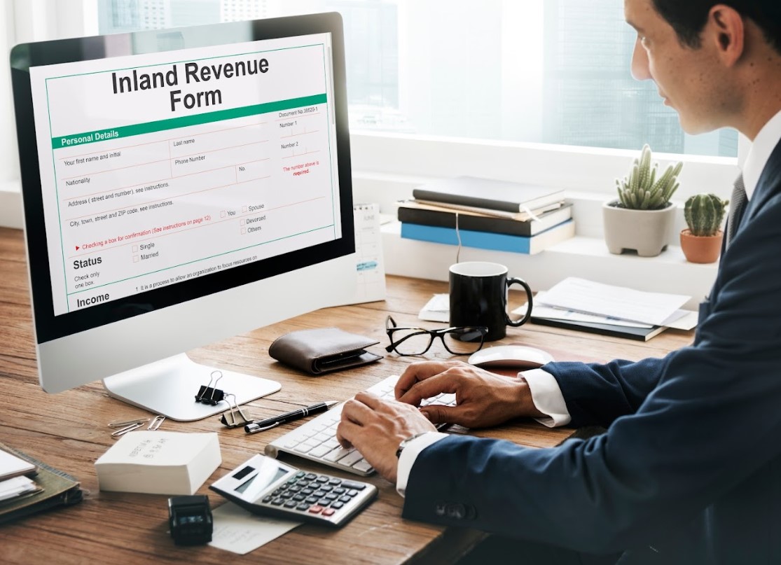 Individual working on Singapore income tax for foreigners via an online filing system